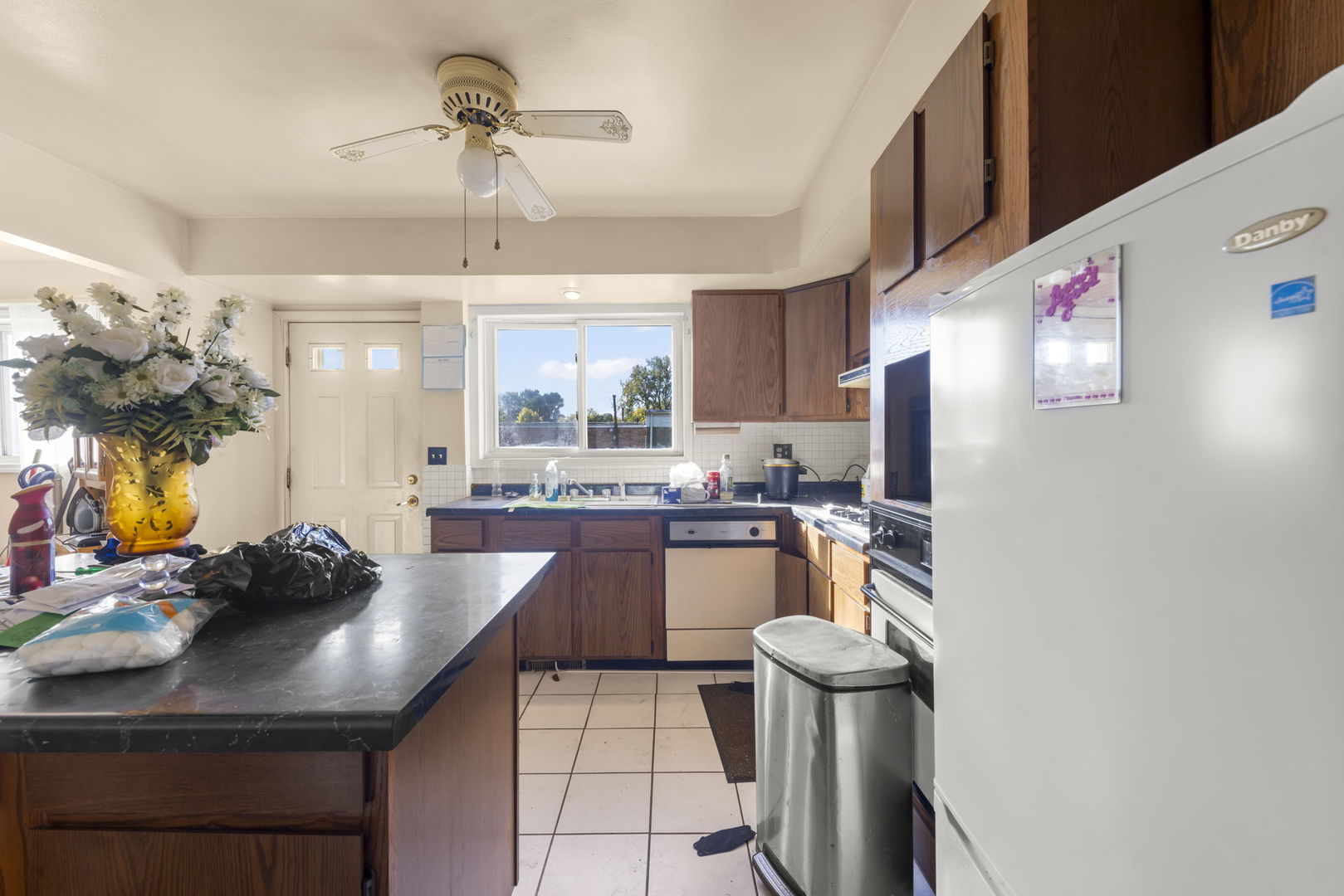 1311 Mcdaniel Avenue, Unit C Evanston, IL 60201 - Photo 8 of 40 a kitchen with a sink cabinets and window