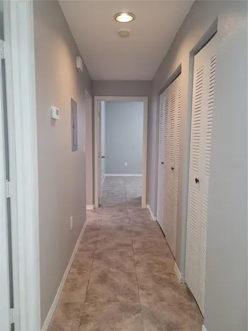 a view of an empty room with a window