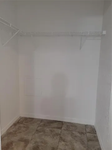 a spacious bathroom with a sink a toilet and a mirror