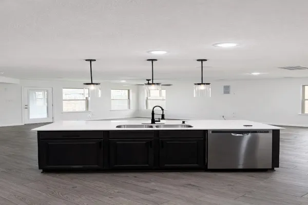 a kitchen with a sink and window
