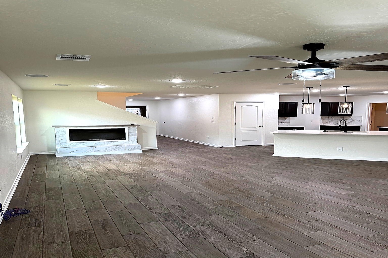 20818 Filbert Lane Katy, TX 77449 - Photo 6 of 19 living room provides granite fireplace, tile flooring.