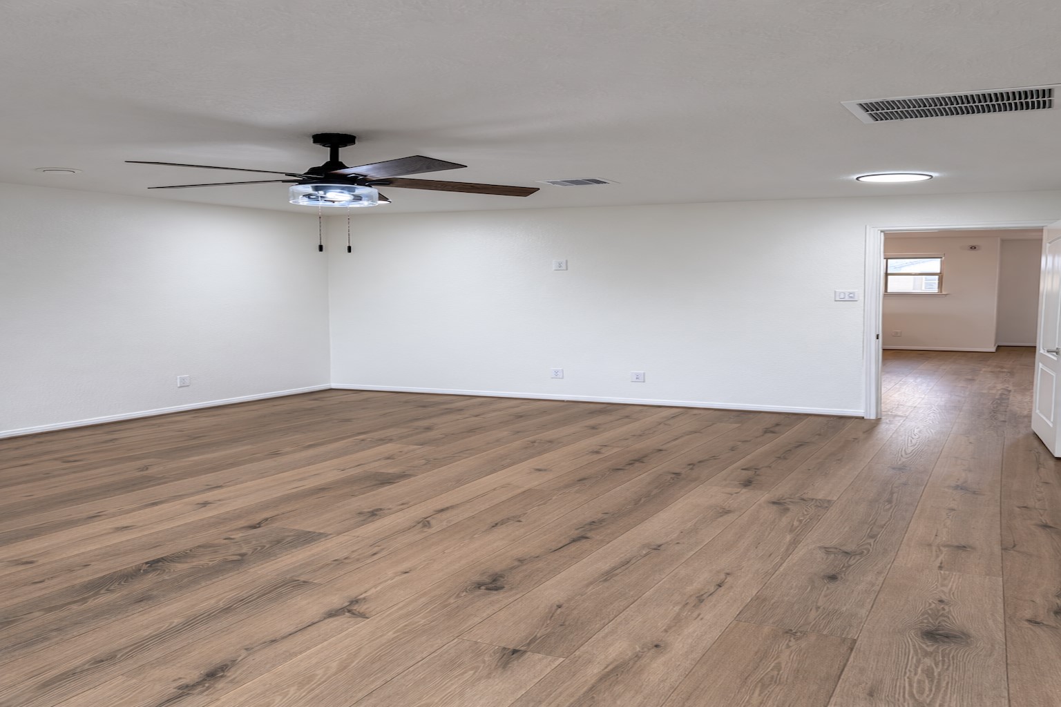 20818 Filbert Lane Katy, TX 77449 - Photo 9 of 19 Primary bedroom located on second floor, wood flooring.