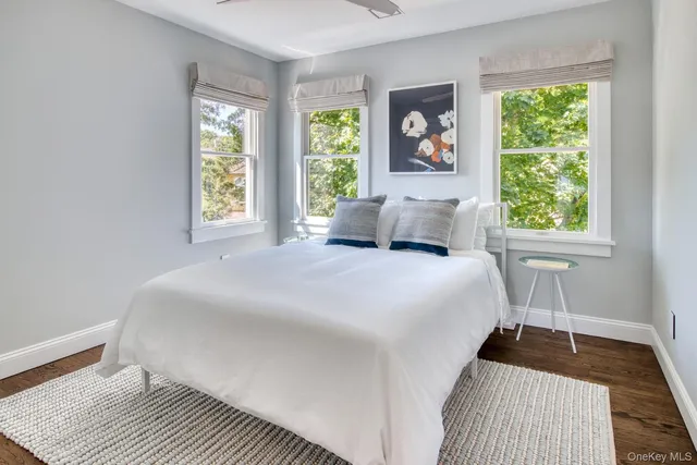 a bedroom with a large bed and a window