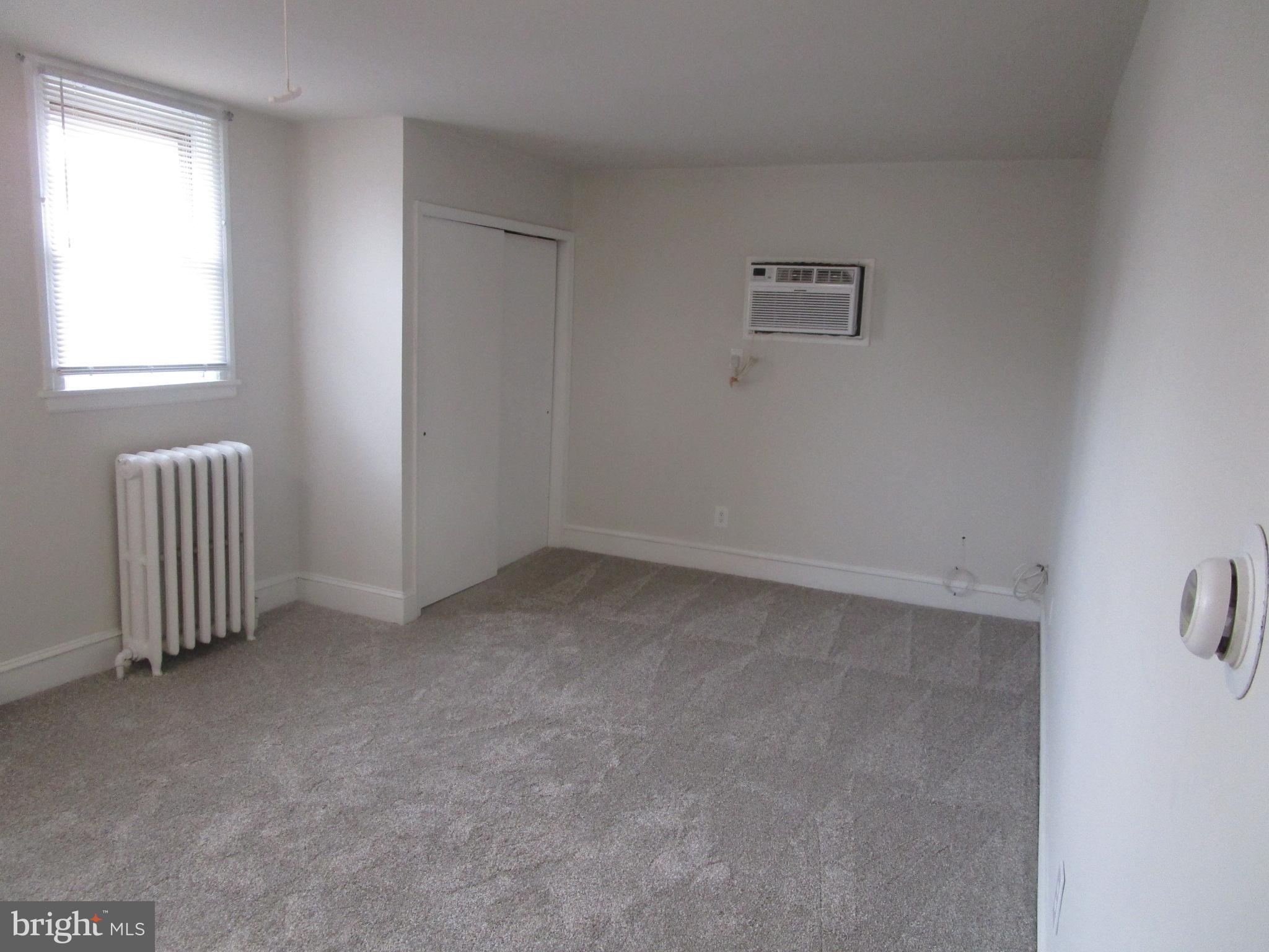 125 West Eagle Road, Unit 2 Havertown, PA 19083 - Photo 3 of 8 an empty room with windows