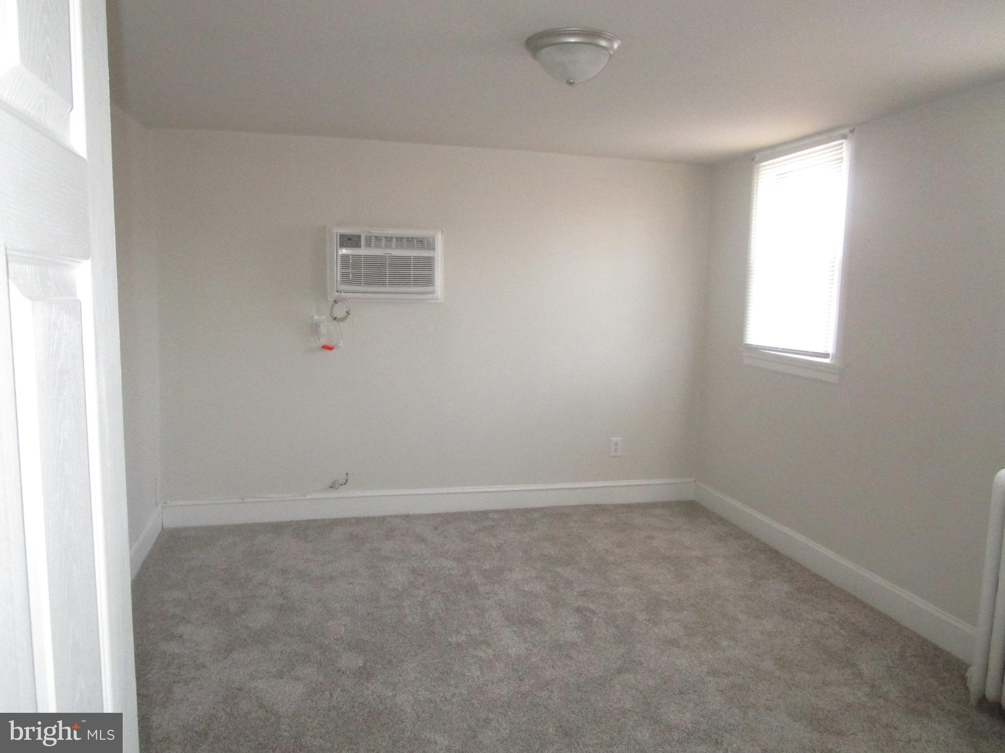 125 West Eagle Road, Unit 2 Havertown, PA 19083 - Photo 5 of 8 an empty room with a window