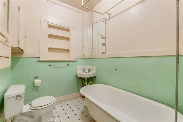 a kitchen with a stove and a refrigerator