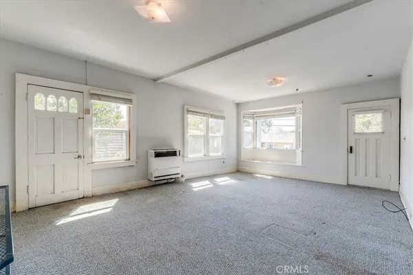 a view of a room that has a window in it
