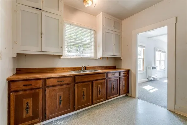 a kitchen with a sink and a window