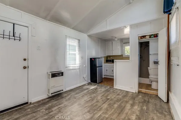a view of a kitchen from a hallway