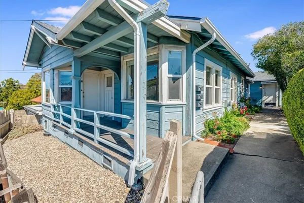 a view of a porch with wooden floor and stairs