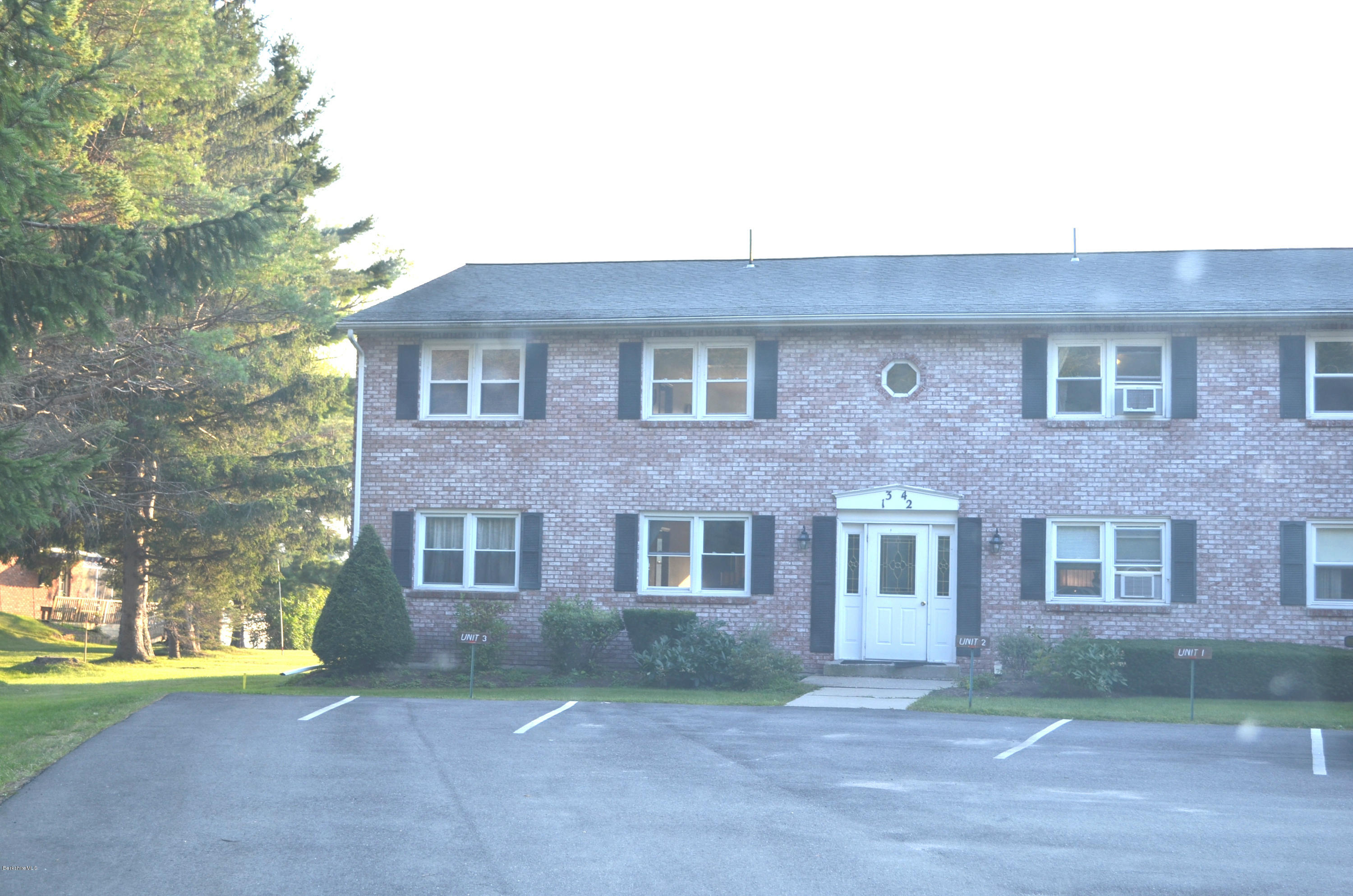 4 Onota Lane, Unit 2 Pittsfield, MA 01201 - Photo 2 of 17 a front view of a house with garden