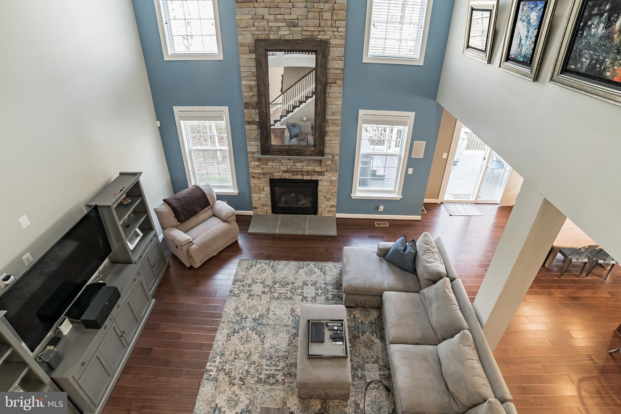 2 story Family Room with 2 story stone fireplace