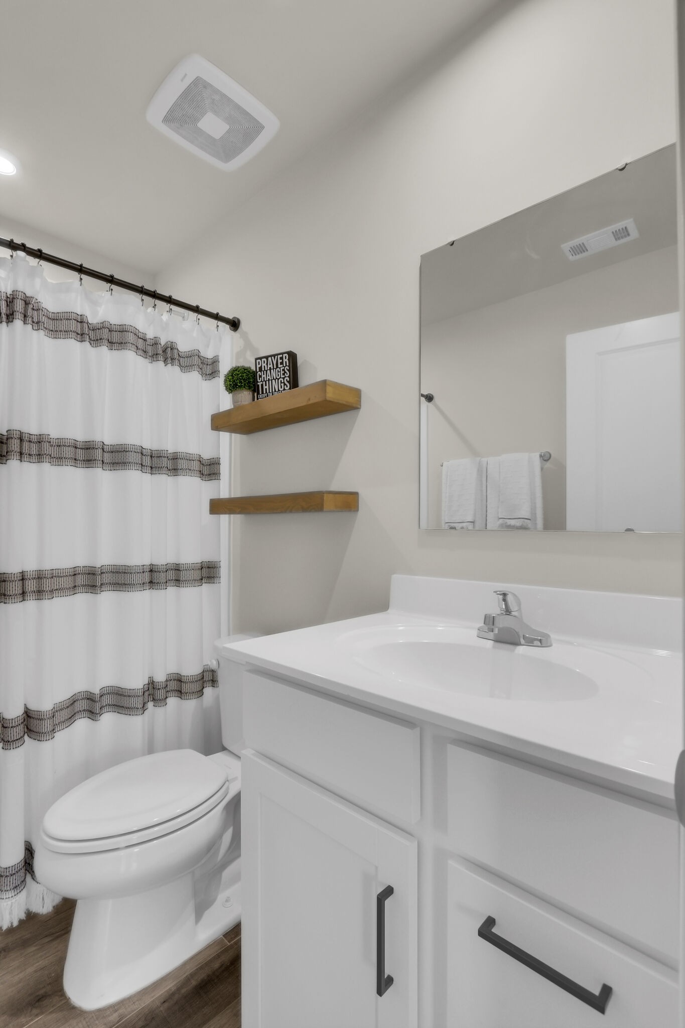 1732 Quail Run Way Spring Hill Spring Hill, TN 37174 - Photo 23 of 28 a bathroom with a sink a toilet and shower curtain