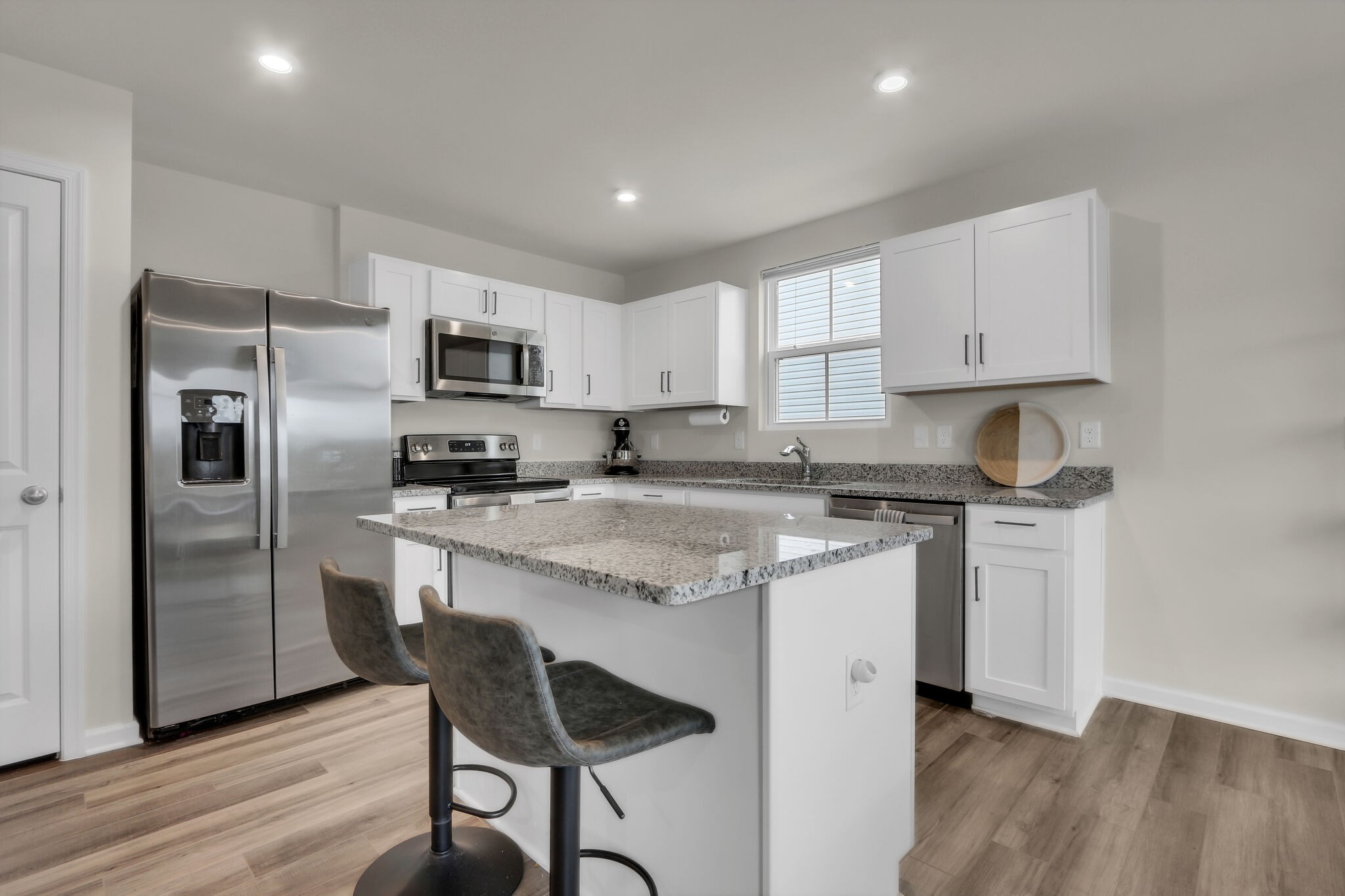 1732 Quail Run Way Spring Hill Spring Hill, TN 37174 - Photo 7 of 28 a kitchen with stainless steel appliances granite countertop a stove a refrigerator and a microwave