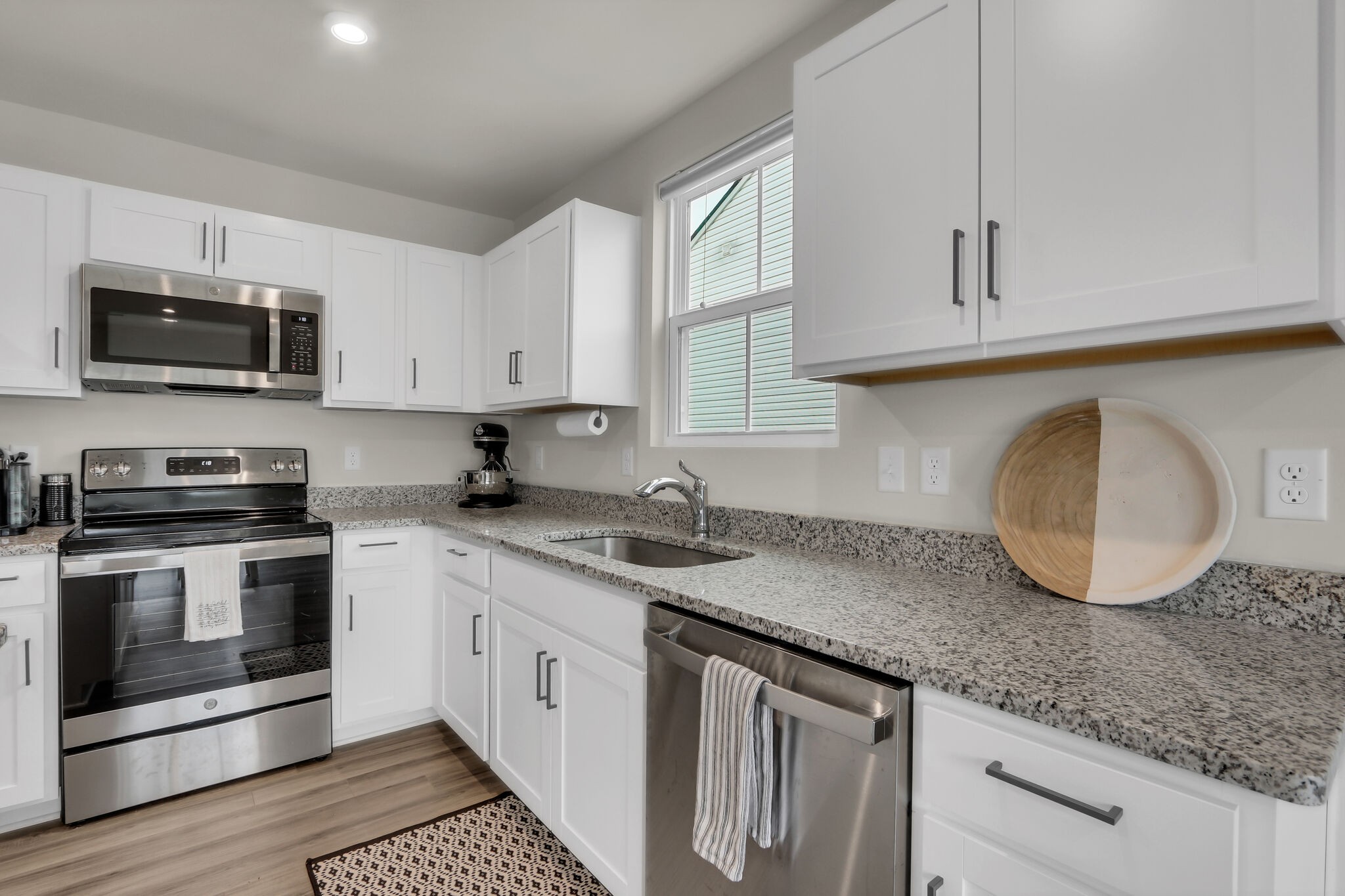 1732 Quail Run Way Spring Hill Spring Hill, TN 37174 - Photo 9 of 28 a kitchen with granite countertop a sink and a stove