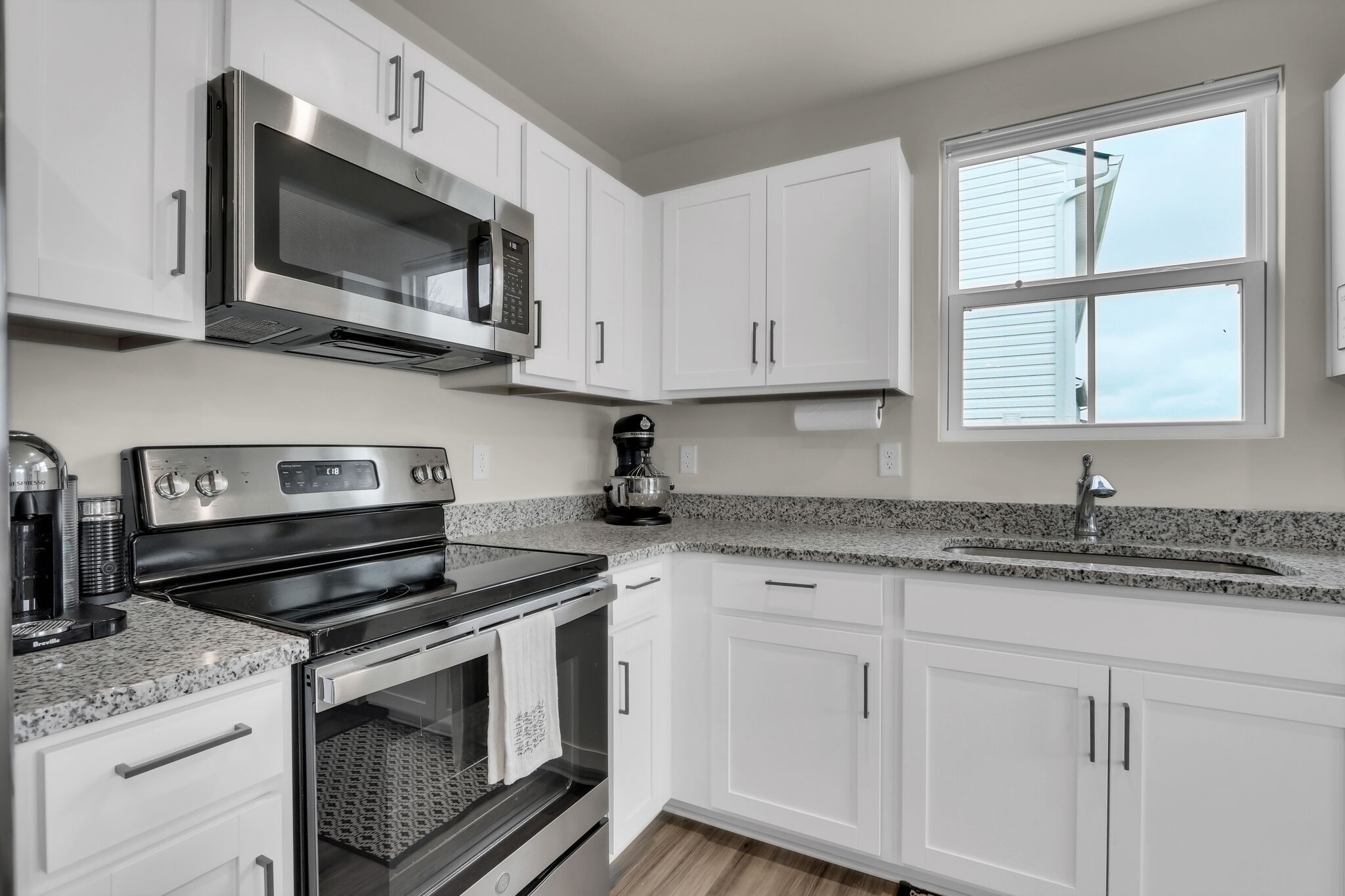 1732 Quail Run Way Spring Hill Spring Hill, TN 37174 - Photo 10 of 28 a kitchen with granite countertop white cabinets and a stove top oven