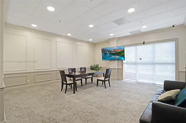 a living room with furniture a window and a table
