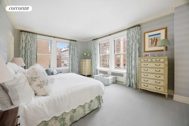 a bedroom with a bed dresser and a window