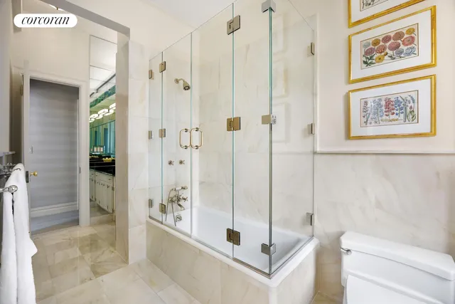 a bathroom with a shower and a sink