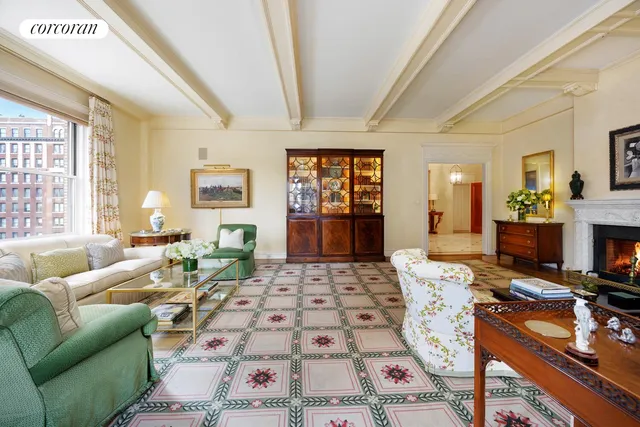 a living room with furniture a rug and a flat screen tv