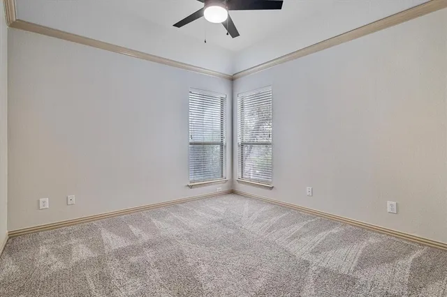 a bathroom with a toilet sink vanity tub and shower