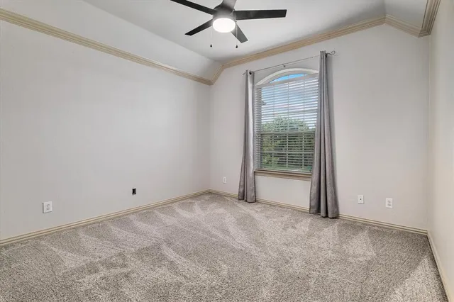an empty room with a empty space and a ceiling fan
