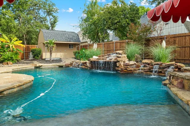 a brick building with a bench and a table