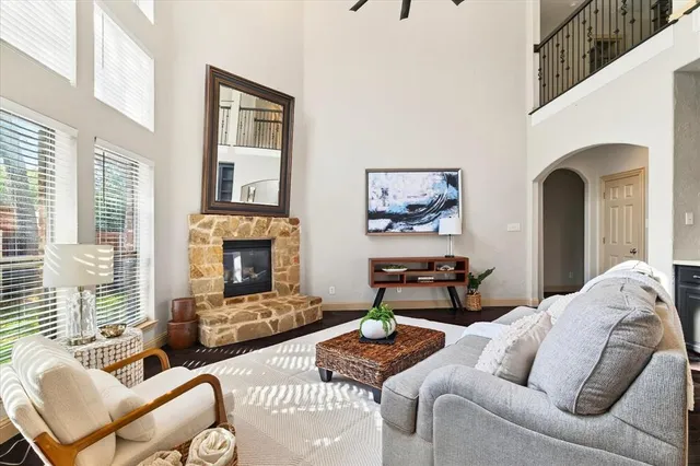 a dining room with wooden floor and chandelier