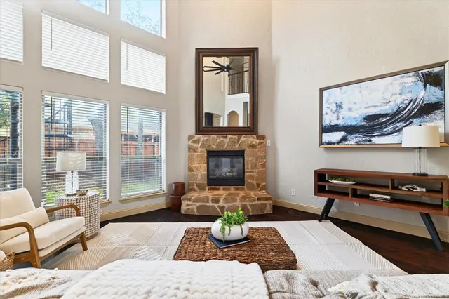 a living room with furniture and a fireplace