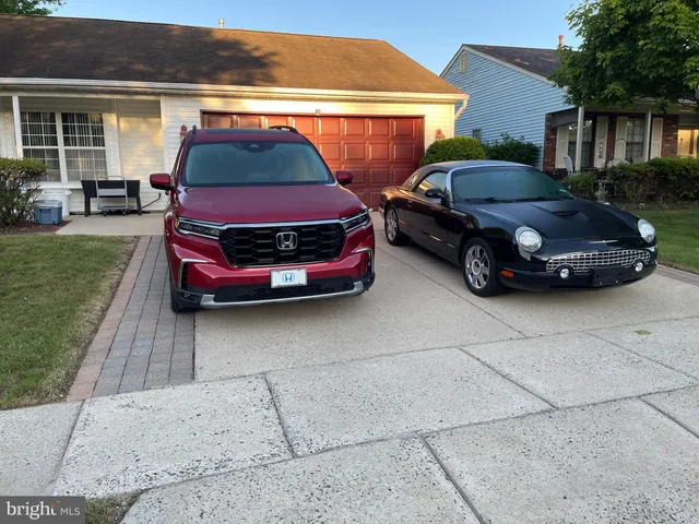 a car parked in front of a house