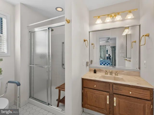 a bathroom with a double vanity sink mirror and double