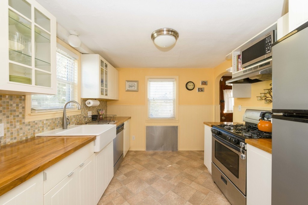 60 Myopia Road Boston, MA 02136 - Photo 8 of 19 a kitchen with stainless steel appliances granite countertop a sink stove and refrigerator