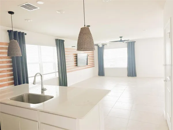 a kitchen with a sink a counter top space and a window
