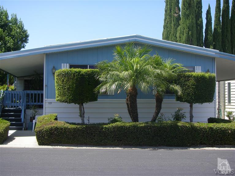 6480 Katherine Road, Unit 126 Simi Valley, CA 93063 - Photo 1 of 18 a front view of a house with garden