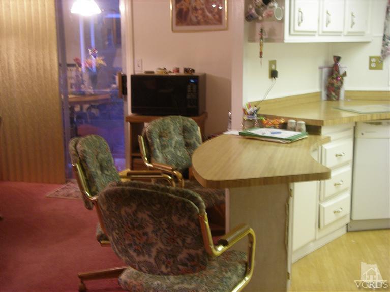 6480 Katherine Road, Unit 126 Simi Valley, CA 93063 - Photo 11 of 18 a picture of a table and chairs in the kitchen