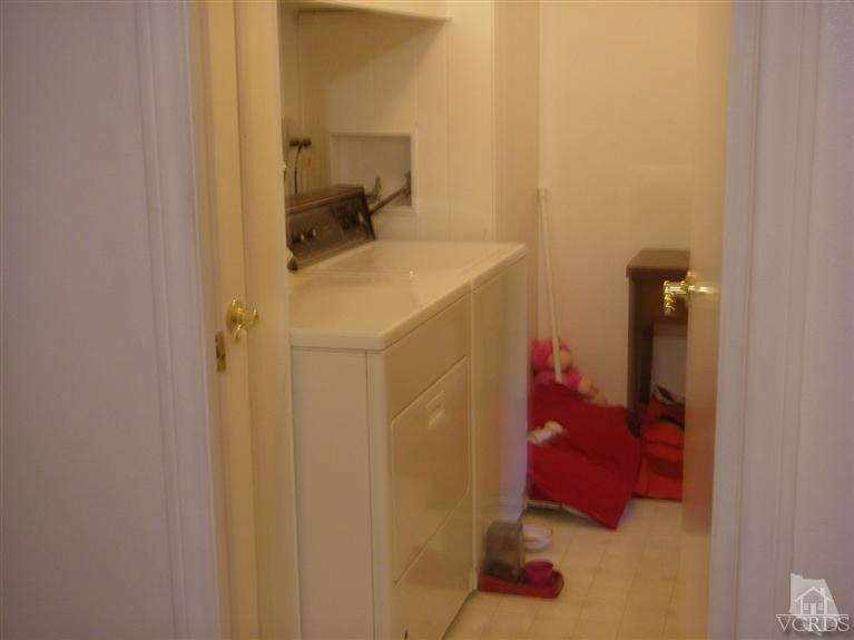6480 Katherine Road, Unit 126 Simi Valley, CA 93063 - Photo 13 of 18 a bathroom with a sink and vanity