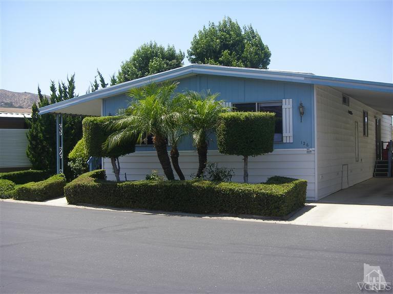6480 Katherine Road, Unit 126 Simi Valley, CA 93063 - Photo 6 of 18 a front view of a house with garden