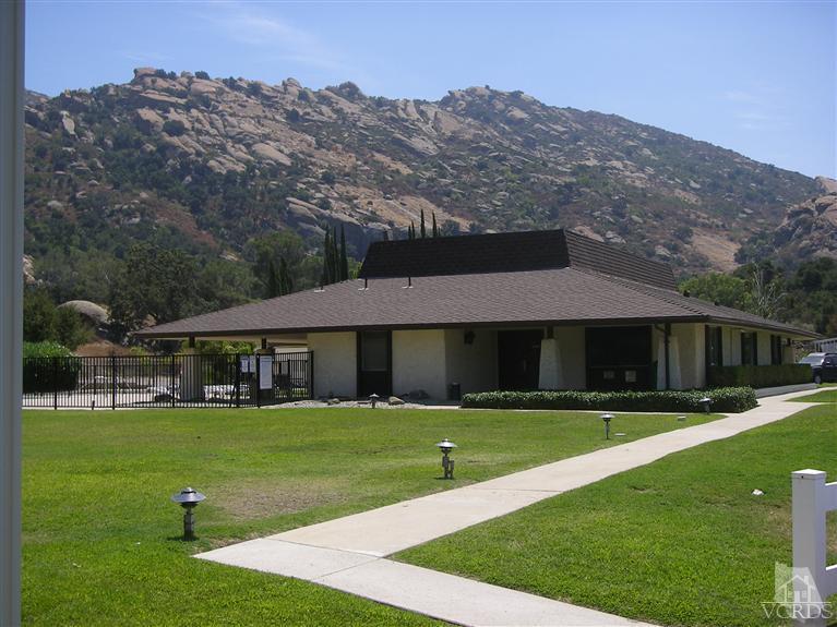 6480 Katherine Road, Unit 126 Simi Valley, CA 93063 - Photo 8 of 18 a view of a house with a big yard