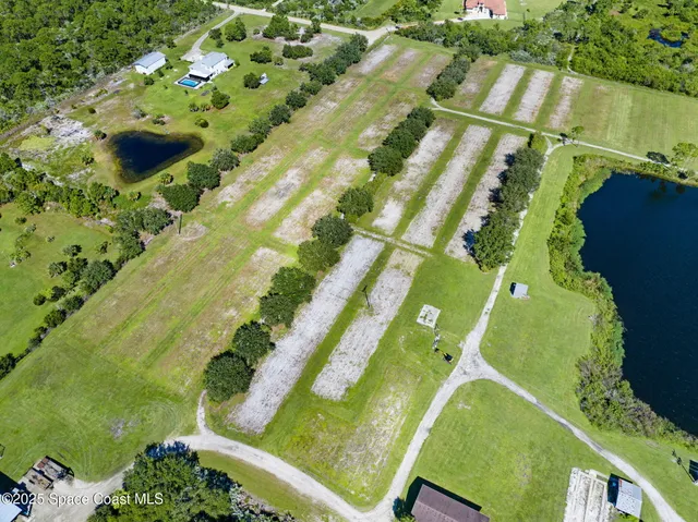 a view of a tennis ground with a large pool