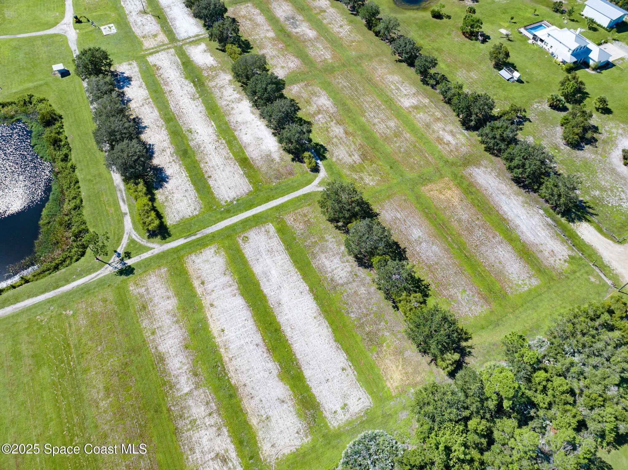 E Berry Road Grant Valkaria, FL 32949 - Photo 24 of 46 a view of swimming pool from a lake