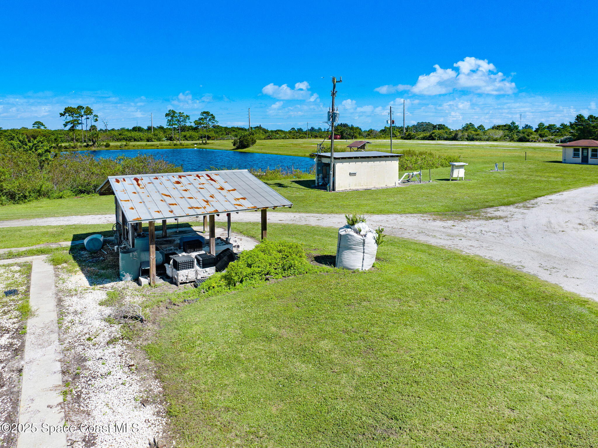 E Berry Road Grant Valkaria, FL 32949 - Photo 45 of 46 an outdoor space with furniture and garden