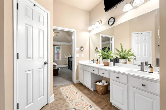 a spacious bathroom with a double vanity sink mirror and