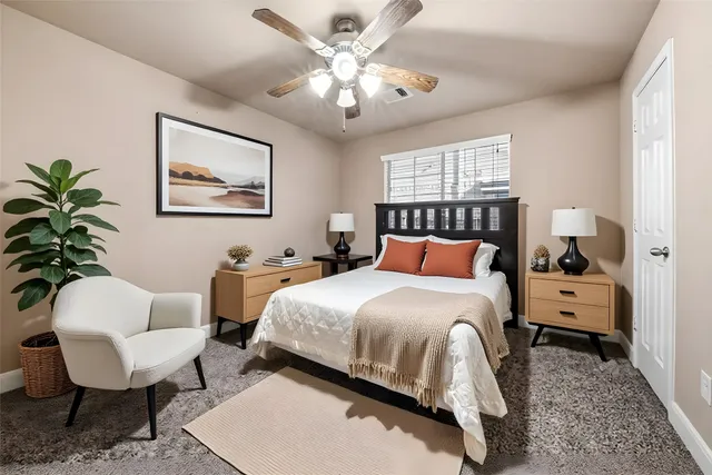 a bedroom with a bed and a couch