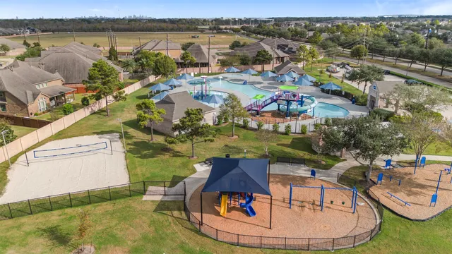 an aerial view of a house with outdoor space lake view and mountain view