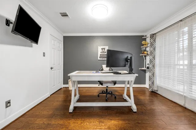 a view of a livingroom with furniture and a flat screen tv
