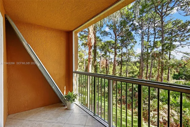 a view of a lake with houses in the back