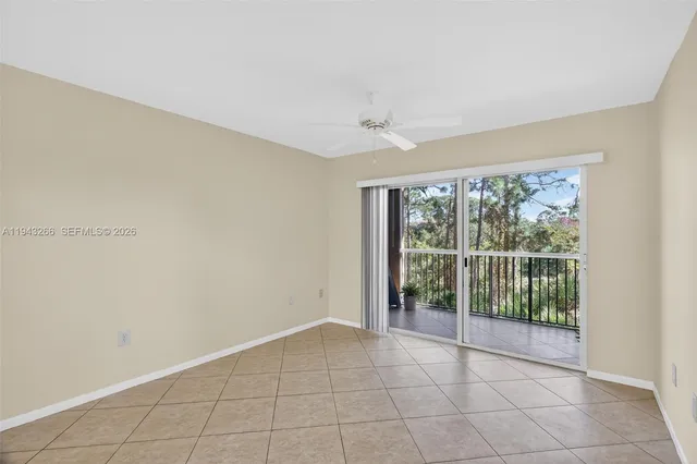 a view of a kitchen with white cabinets