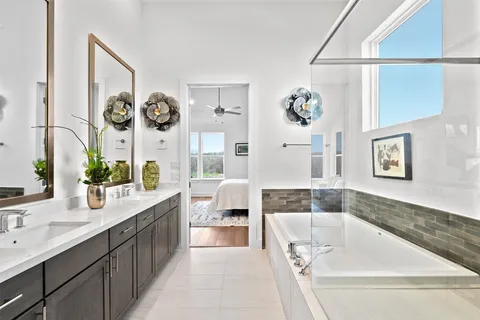 a bathroom with a bathtub and a shower