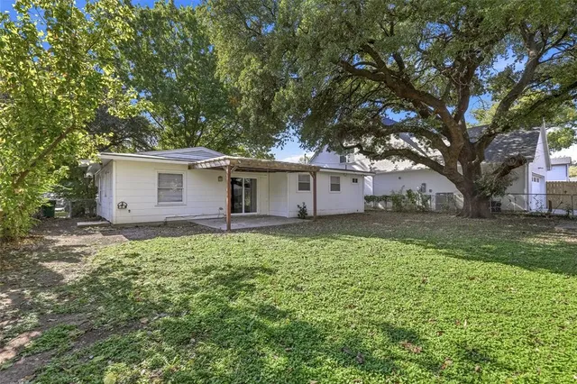 a house view with a backyard space