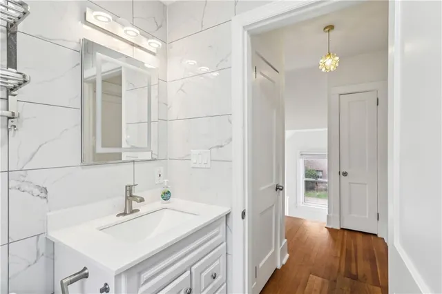 a bathroom with a sink and a mirror